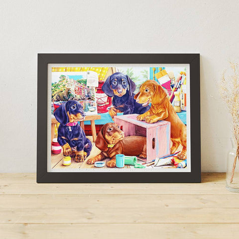 Framed jigsaw puzzle of puppies in a studio setting.